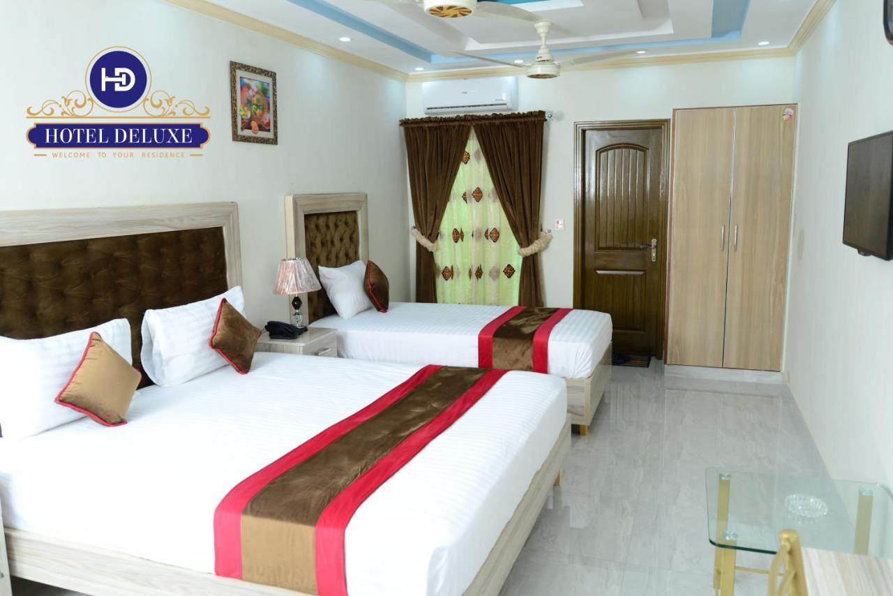 Hotel Deluxe Lahore Bagian luar foto